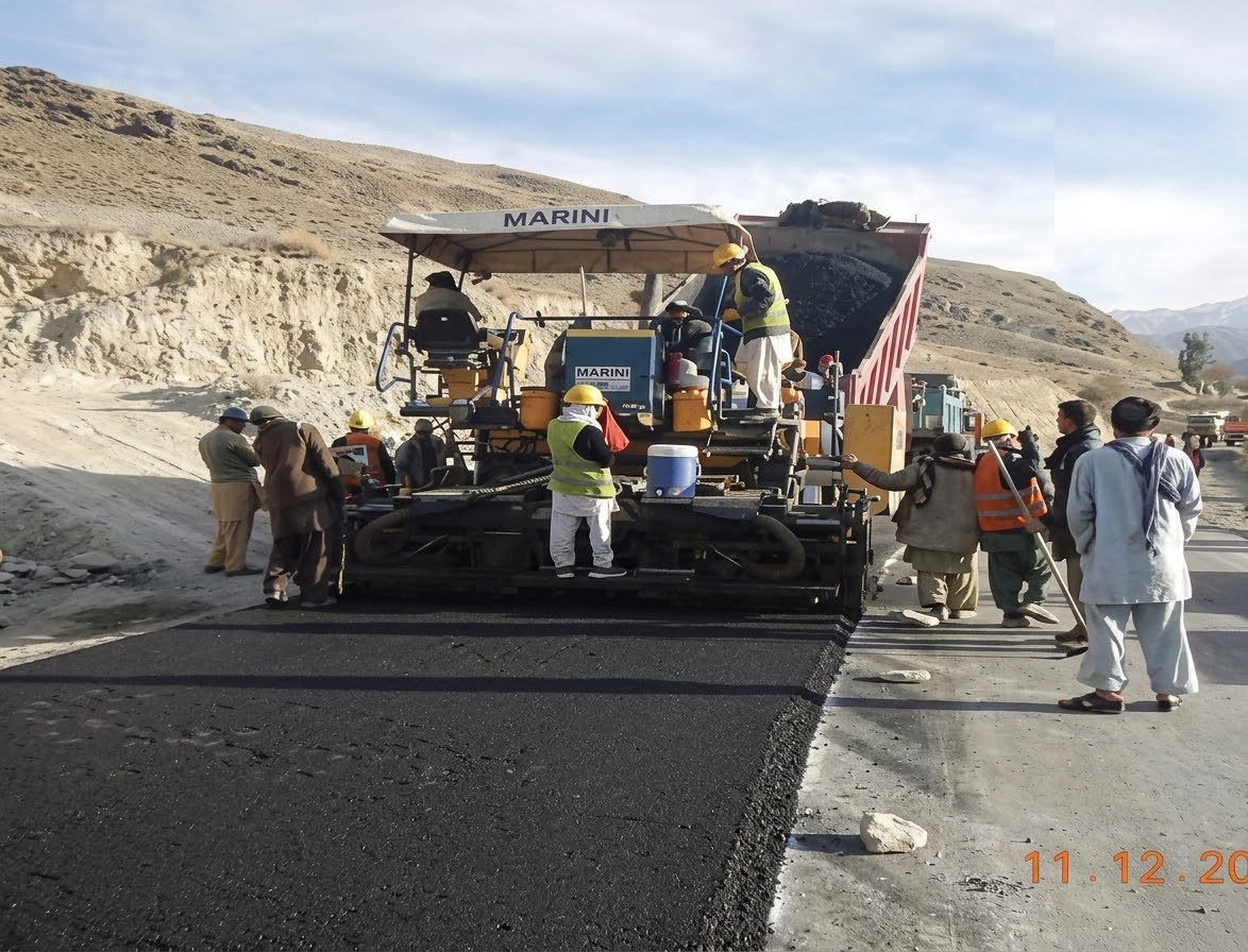 A Marini asphalt paver and MECC crew laying surface course on the Gardez to Khost road in Paktiya province